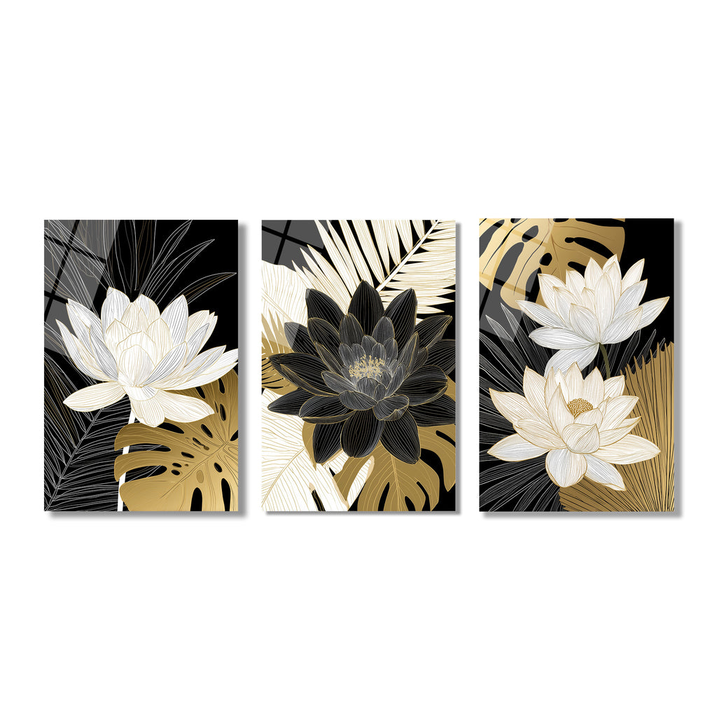 Siyah zemin üzerinde altın ve beyaz çizgisel lotus çiçekleri ile tropikal yaprak desenlerinin yer aldığı, modern ve lüks görünüşlü üç parçalı cam tablo seti.