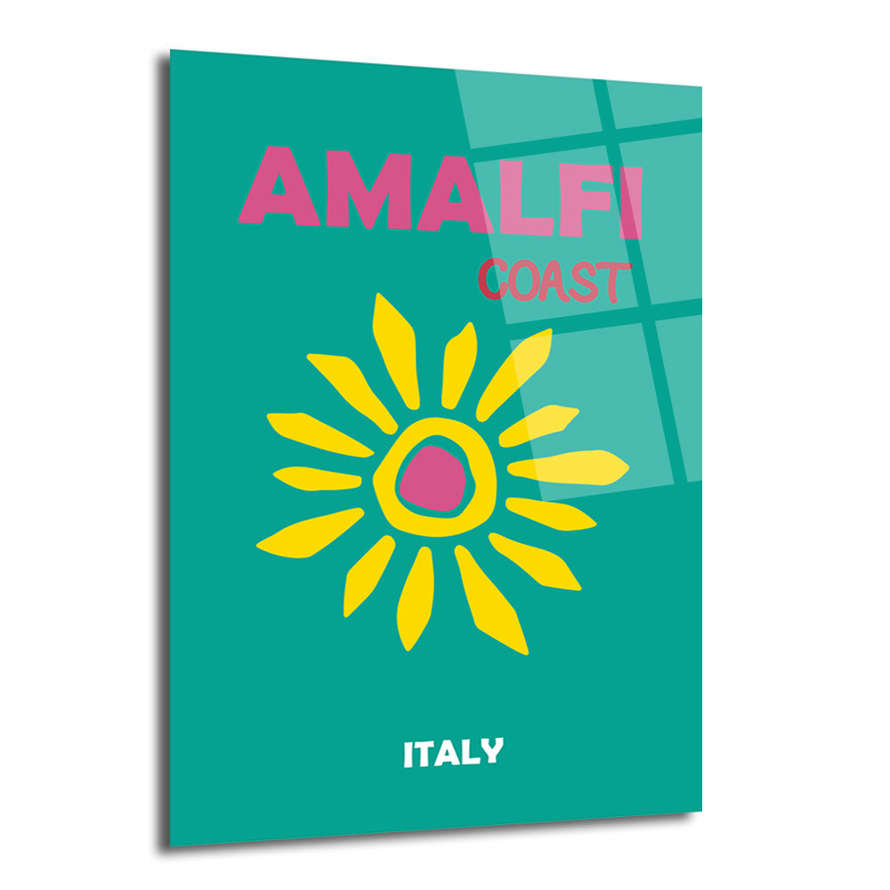 Turkuaz fon üzerinde pembe 'AMALFI COAST ITALY' yazısı ve ortasında sarı ve pembe renklerde stilize edilmiş bir güneş figürü bulunan modern cam tablo.