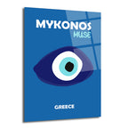 Koyu mavi zemin üzerinde, ortasında büyük, stilize bir nazar boncuğu figürü ve üstte 'MYKONOS MUSE', altta 'GREECE' yazısı bulunan parlak cam duvar sanatı.