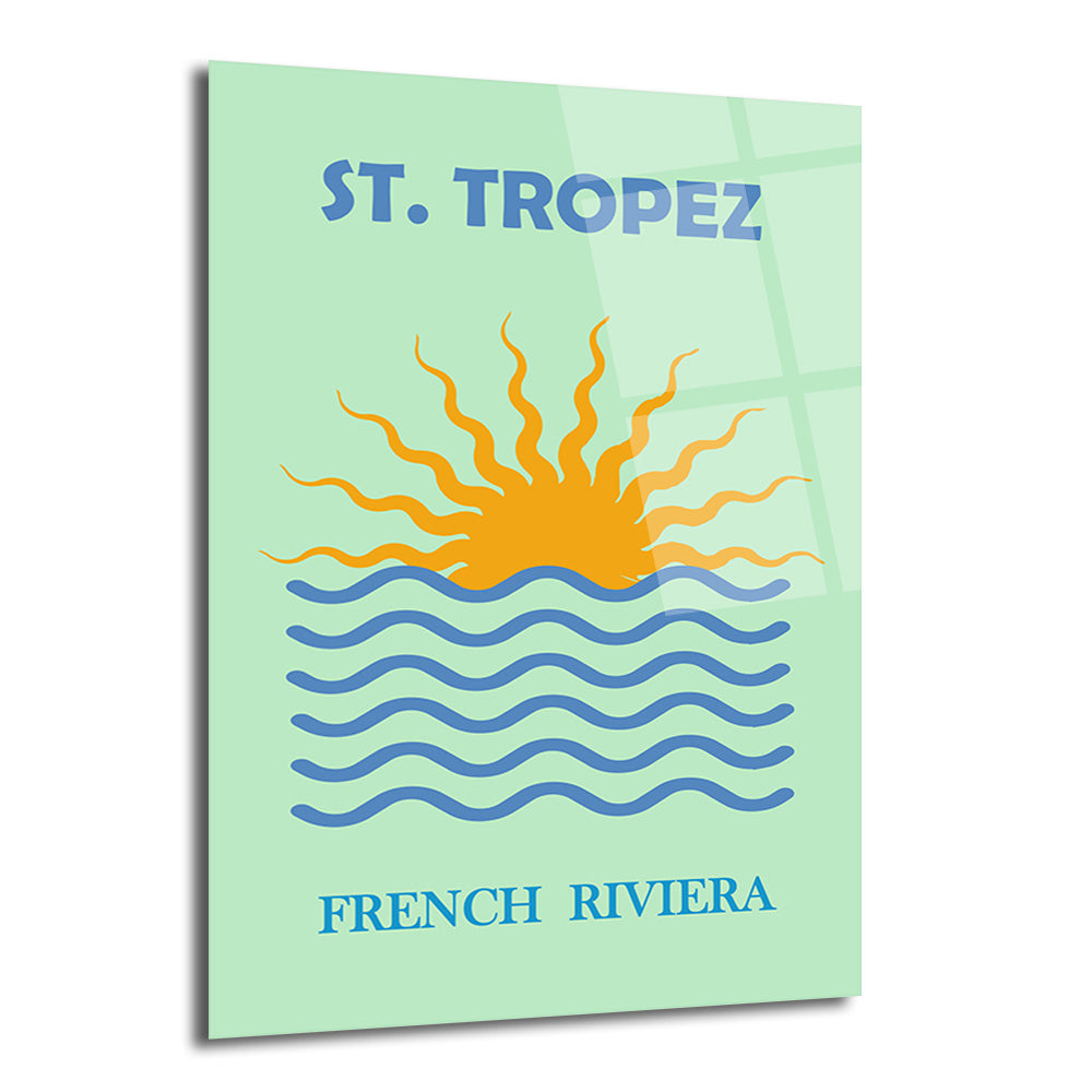 Açık mint yeşili zeminde St. Tropez yazısı, denize batan turuncu güneş ve mavi dalgalar içeren minimalist bir cam tablo.