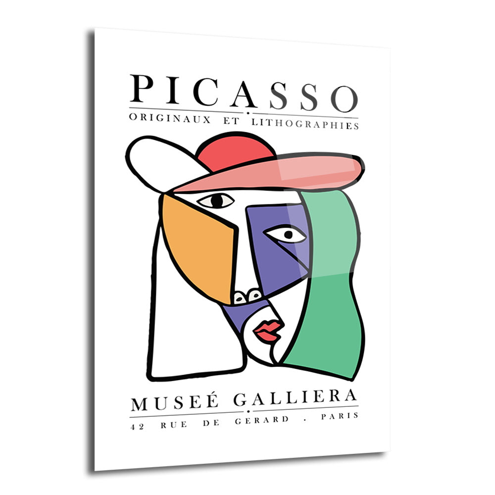 Beyaz zemin üzerinde, Picasso'nun kübist tarzında soyut bir insan yüzü portresi bulunan cam tablo. Yüz, turuncu, mor, yeşil, kırmızı ve pembe gibi canlı renklerle geometrik şekillerden oluşuyor. Üst kısımda 'PICASSO ORIGINAUX ET LITHOGRAPHIES' ve alt kısımda 'MUSEE GALLIERA PARIS' yazıları yer alıyor.