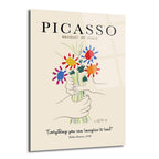Açık krem renkli arka plan üzerinde, Pablo Picasso'nun Barış Buketi adlı eserinin minimalist çizimini gösteren cam tablo. İki elin tuttuğu, kırmızı, mavi, sarı ve turuncu renkli stilize çiçeklerden oluşan bir demet öne çıkıyor. Üstte 'PICASSO BAUQUET OF PEACE', altta ise 'Everything you can imagine is real' yazısı bulunuyor.
