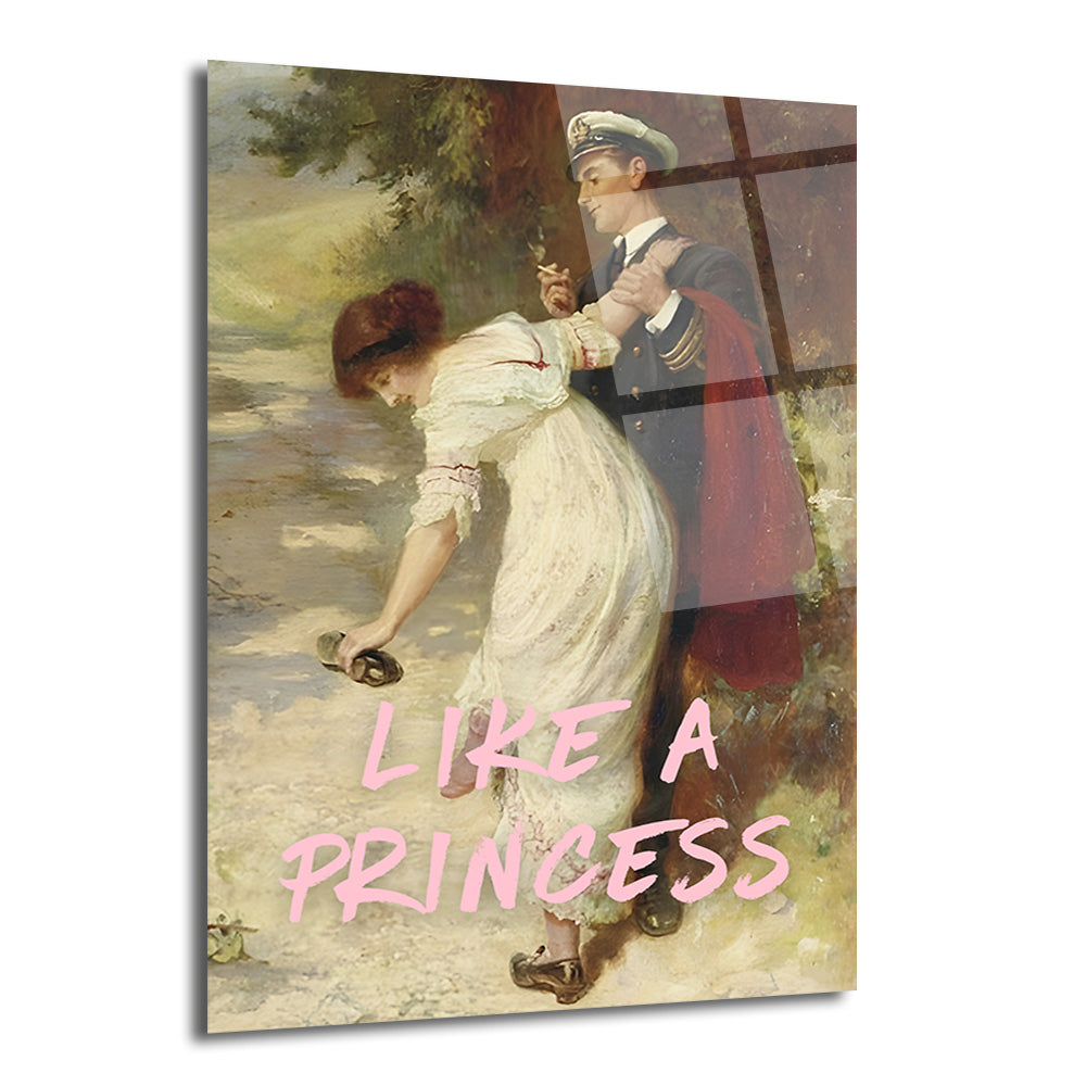 Klasik bir tablo üzerinde pembe renkte 'LIKE A PRINCESS' yazısı bulunan, beyaz elbiseli bir kadının ayakkabısını düzeltirken, lacivert üniformalı bir erkeğin ona destek olduğu romantik ve sanatsal bir cam tablo.