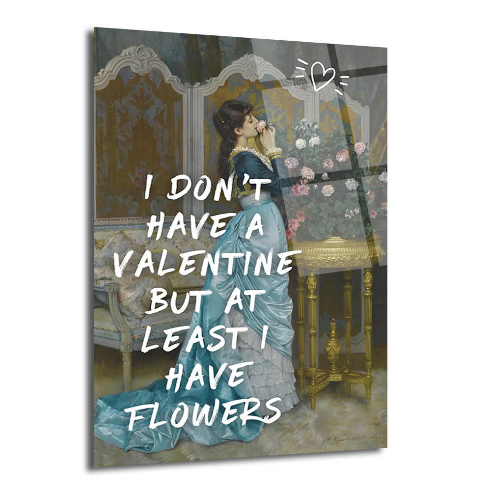Mavi elbiseli bir kadının bir gülü kokladığı klasik bir tablo üzerine beyaz harflerle 'I DON'T HAVE A VALENTINE BUT AT LEAST I HAVE FLOWERS' yazısı ve üstte kalp çizimi bulunan cam tablo.