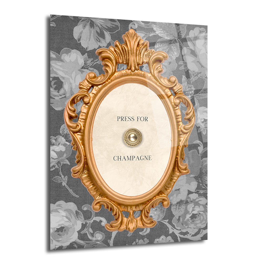 Gri çiçek desenli arka planda, "PRESS FOR CHAMPAGNE" yazılı ve ortasında altın bir düğme bulunan, gösterişli altın oval çerçeveli bir cam tablo.